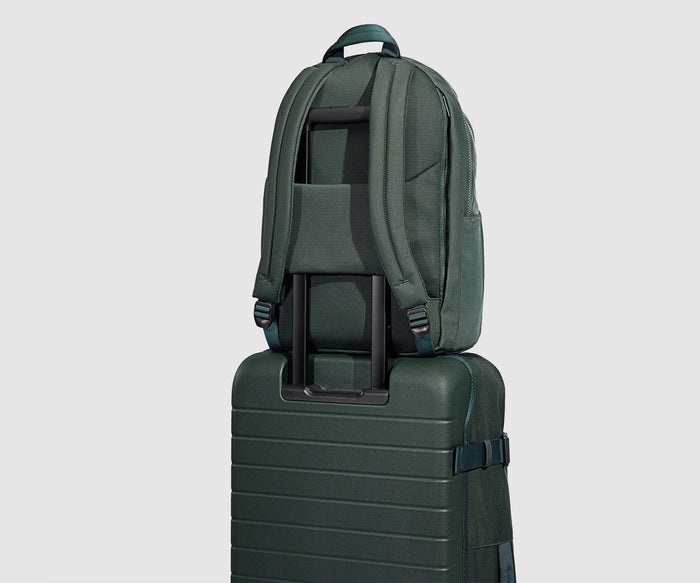 Active Backpack 26L secured to the Active Rolling Duffle 85L by its trolley sleeve
// Designed with a trolley sleeve that slides onto your suitcases to keep it in place while you're on the move. Paired with the Active Rolling Duffle 85L.