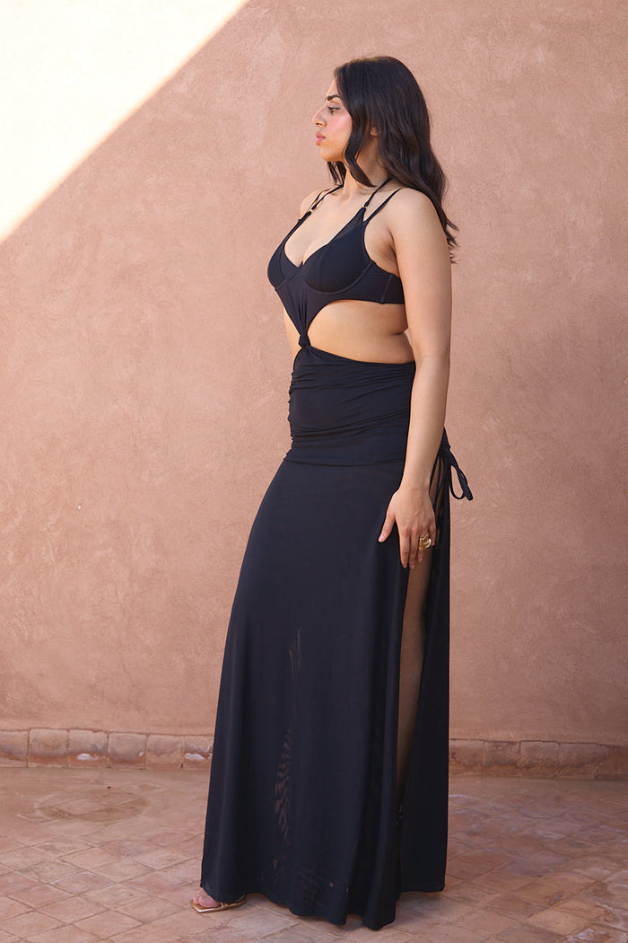 a woman in a black dress
