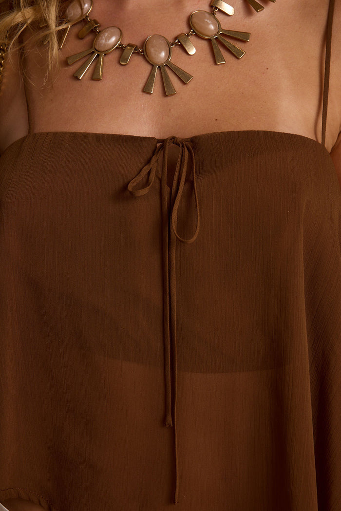 Costella Mocha Asymmetrical Top shown in a complementary styling arrangement.