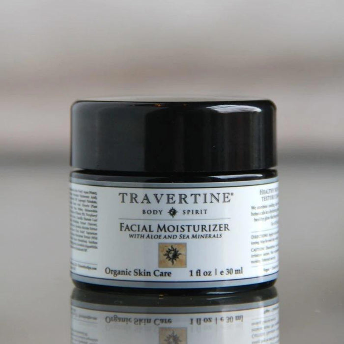 Jar of Facial Moisturizer (with Aloe and Sea Minerals) | Travertine Spa featuring organic skincare formulation in a compact black container for hydration and skin wellness.