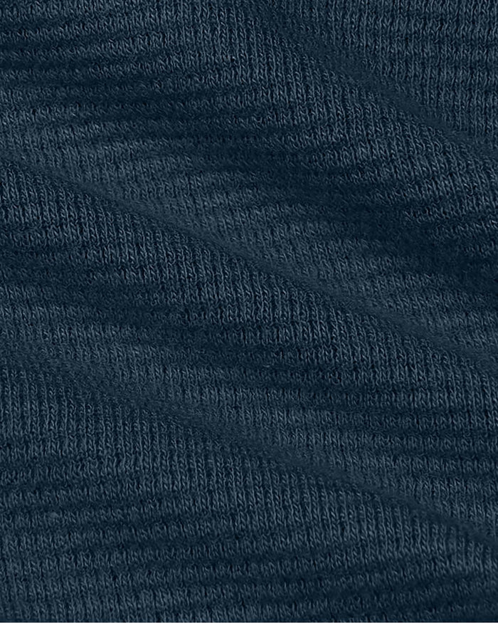 Close-up of Womens Navy Waffle Long Sleeve Henley & Waffle Leg Pant knit fabric.
