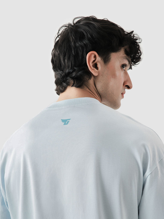 96 Double Layer Jersey frost blue male model seated lifestyle shot Pakistan – GROOVY