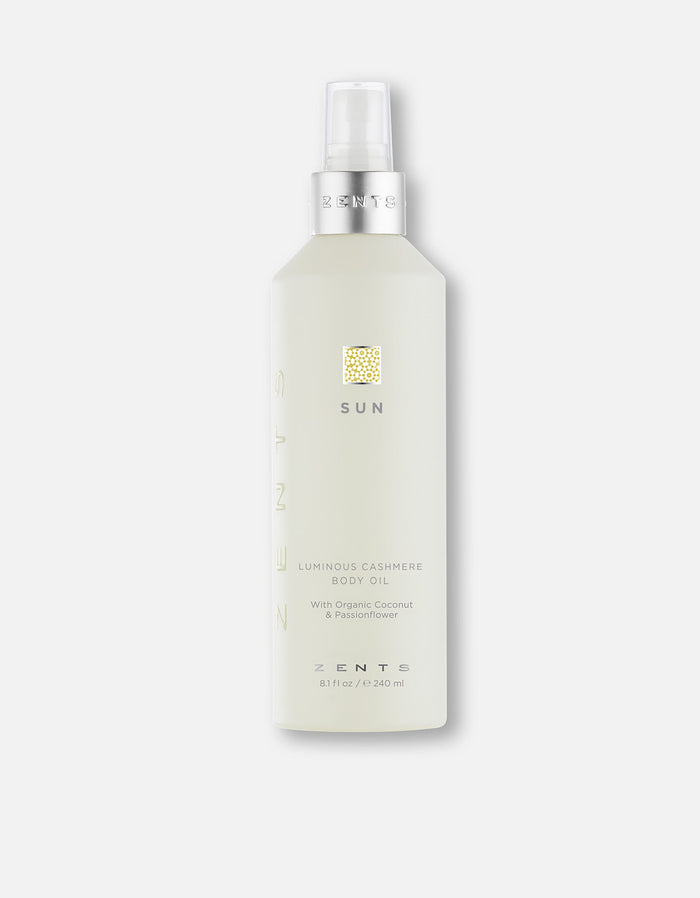 Bottle of Body Oil | Zents in a light translucent container with a silver pump, labeled with "Sun" and featuring organic coconut and passionflower ingredients for skincare and body care.