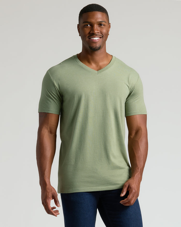 Man wearing Dark Heather Bay Green Tall Classic V-Neck, smiling, relaxed stance.