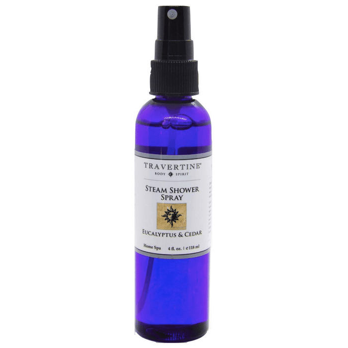 Bottle of Eucalyptus + Cedar Steam Shower Spray (4oz) | Travertine Spa in a blue spray container with a white label for wellness and body care.