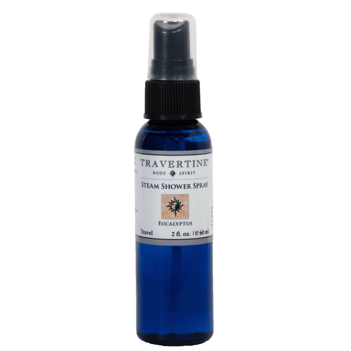 Blue spray bottle of Eucalyptus Steam Shower Spray | Travertine Spa with black spray nozzle and white label featuring eucalyptus design for wellness and body care.