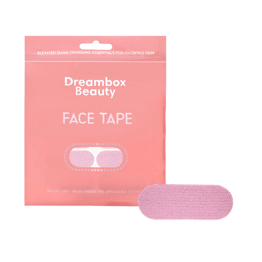 Packaging and a single pink adhesive strip of Face Tape | Dreambox Beauty designed for skincare use to help sculpt and lift for glowing skin.