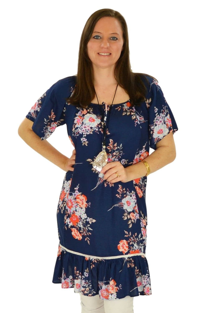 I Love Tunics Fern's Flower Tunic Top displayed on a hanger, featuring a floral pattern and lightweight fabric.