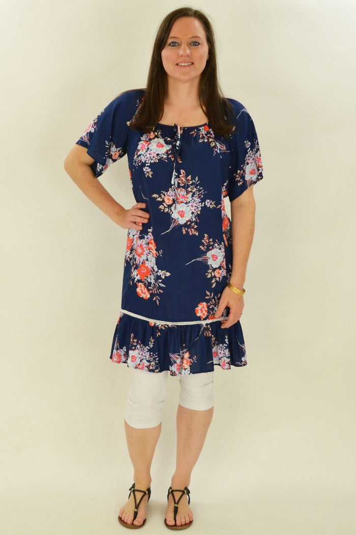 Fern's Flower Tunic Top by I Love Tunics, floral printed tunic with flowy fabric and long sleeves, displayed on a hanger.