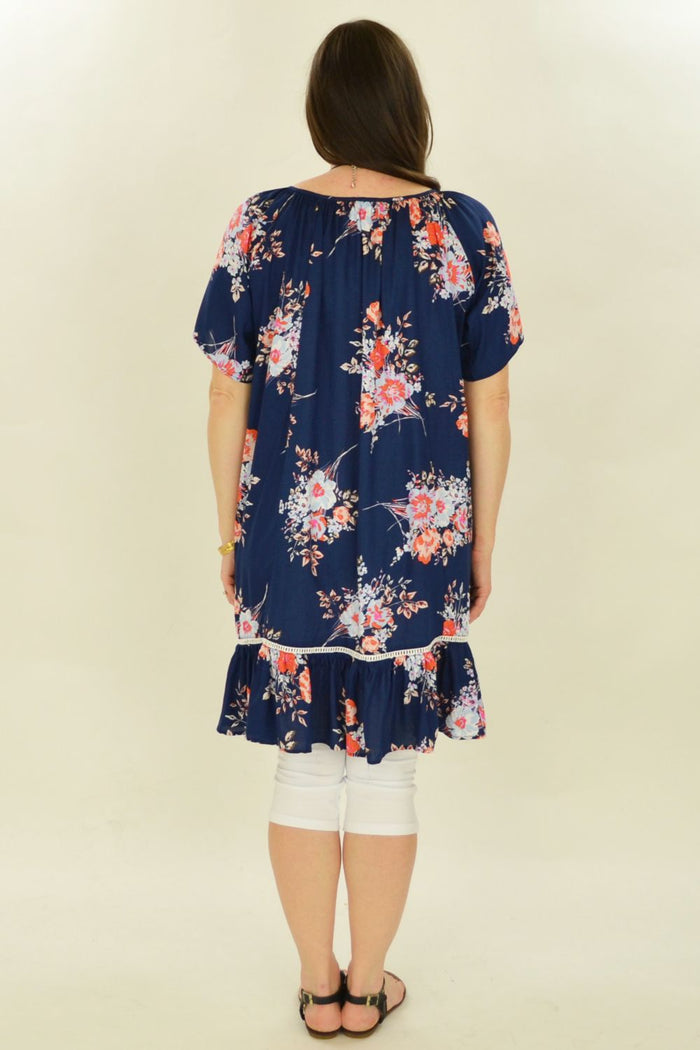 I Love Tunics Fern's Flower Tunic Top in lightweight fabric with a floral pattern and relaxed fit, displayed on a hanger.