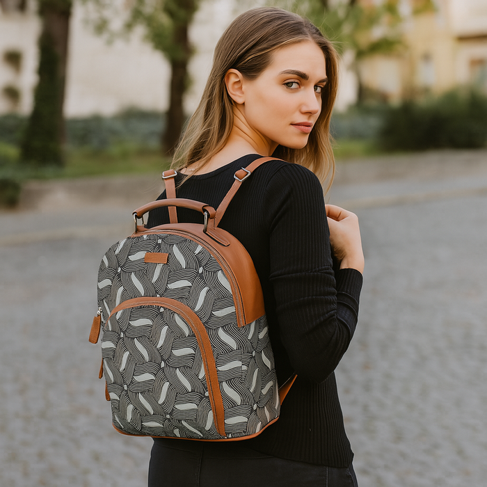 Olive green printed canvas travel backpack with slim vertical silhouette for travel and everyday use-model image