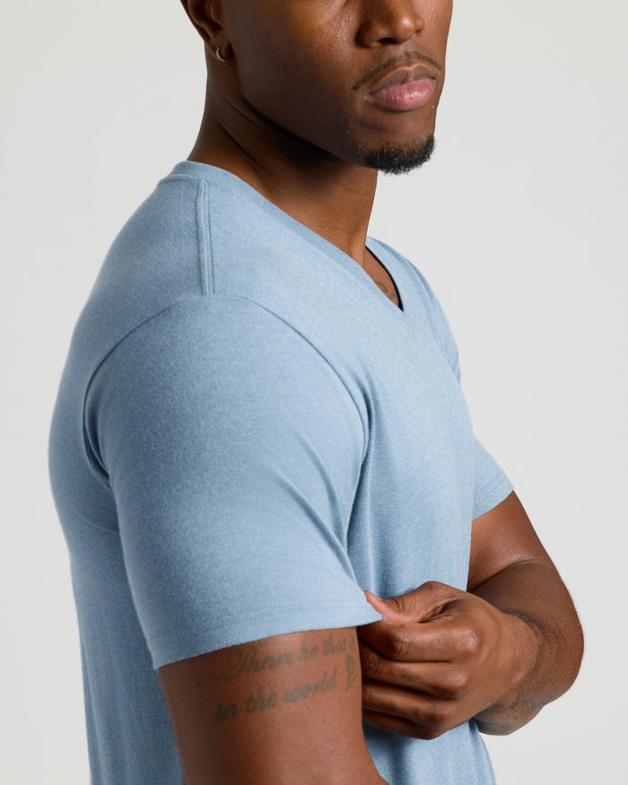 Man wearing Heather Indigo Tall Short Sleeve Classic V-Neck, showcasing tailored fit.