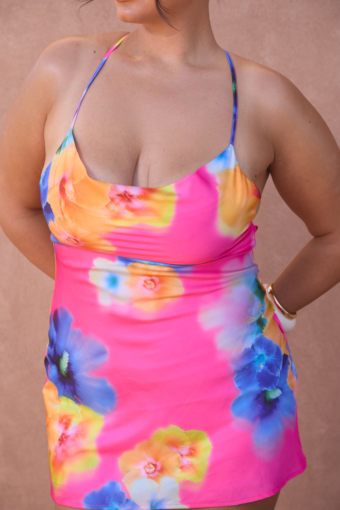 a woman wearing a colorful dress