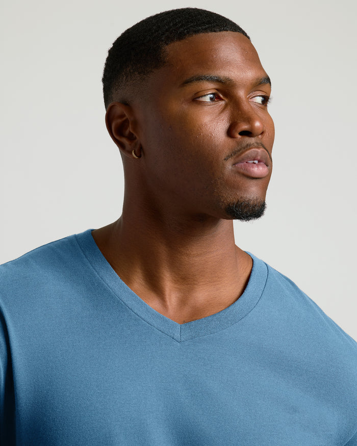 Young man wearing Indigo Tall Short Sleeve Classic V-Neck.