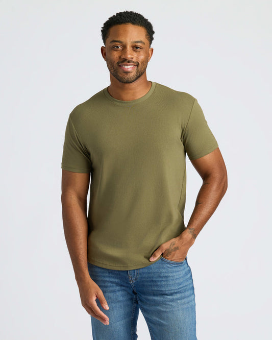 Man wearing Military Green Curved Hem Classic Crew Neck, smiling, with relaxed posture.