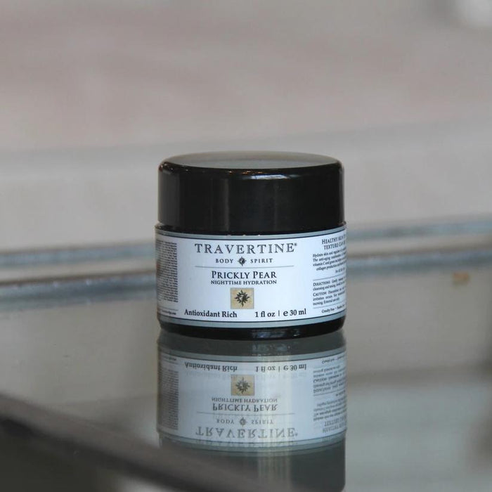 Jar of Prickly Pear Nighttime Hydration | Travertine Spa body care product on reflective surface, highlighting skincare for antioxidant-rich hydration.