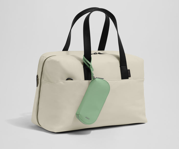 Sunglasses pouch attached to the Everywhere Bag strap
//
Paired with The Everywhere Bag.