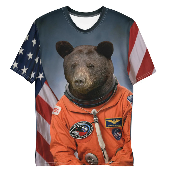 A photorealistic black bear's head (deep espresso fur) crowns the body of a human astronaut in a high-visibility orange flight suit, complete with space agency patches and mission emblems. Contact us with accessibility feedback, we'd love to help!
