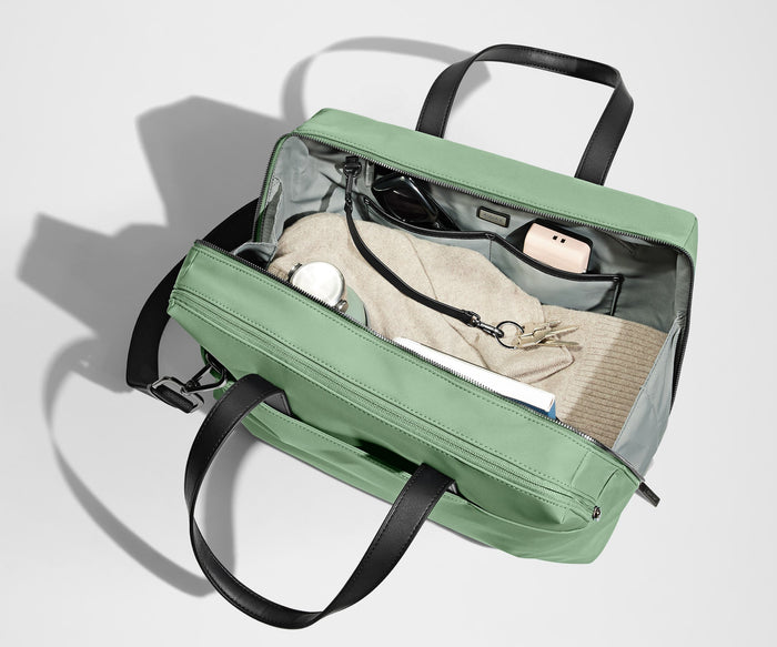 A pair of keys attached to the key leash in the main compartment