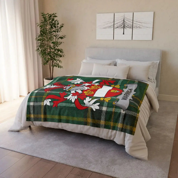 Cozy Green Plaid Blanket with Decorative Crest Design