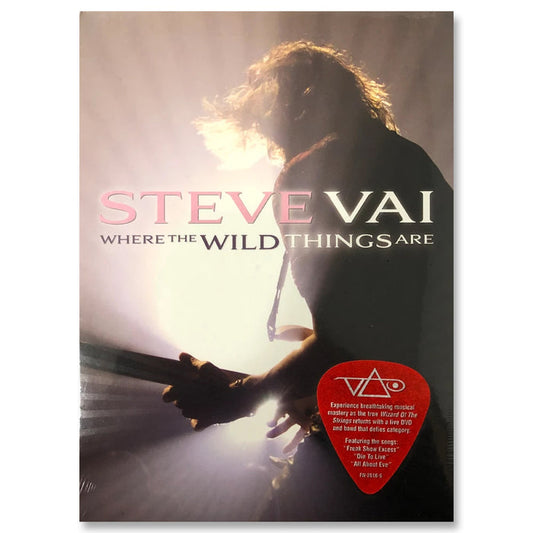 steve vai album artwork against white background. image of steve vai facing away from camera, playing guitar on stage. a white stage light shines on him. across this image in pink, white, and black text reads "where the wild things are". the bottom right has a red guitar pick with the white steve vai logo on it. The steve vai logo makes the word "vai" with an upside down triangle, a right side up one, and a line going across the triangles with a curl at the end next to the triangle that is uprig