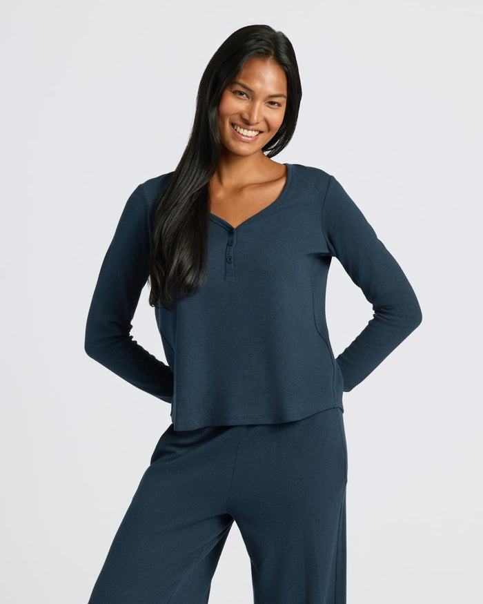 Womens Navy Waffle Long Sleeve Henley & Waffle Leg Pant 2-Pack worn by smiling woman.